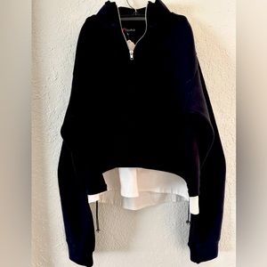 Super soft sporty zip pullover with a faux mock layered blouse underneath.
